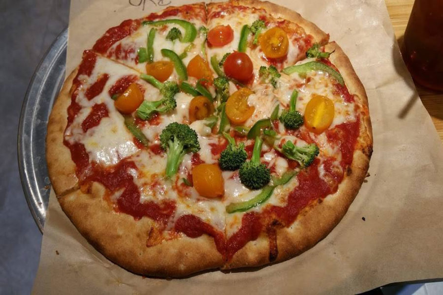 pizza with broccoli, green pepper, and tomato from Dells Pizza Lab in Wisconsin Dells, WI