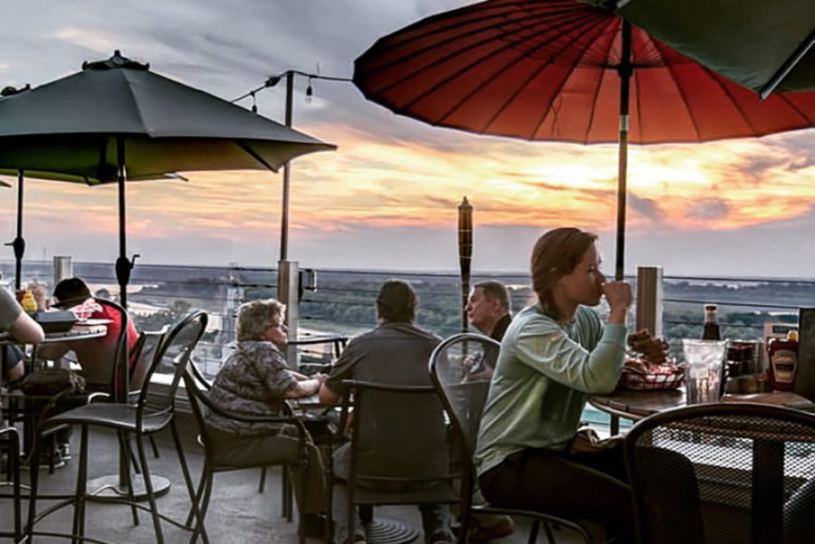 Diners take in the sunset at 10 South Rooftop in Vicksburg, MS