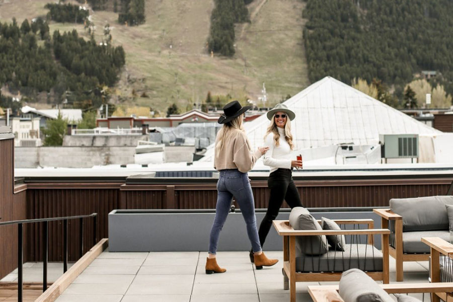 diners enjoying the rooftop patio at the bistro at cloud veil in jackson, wyoming