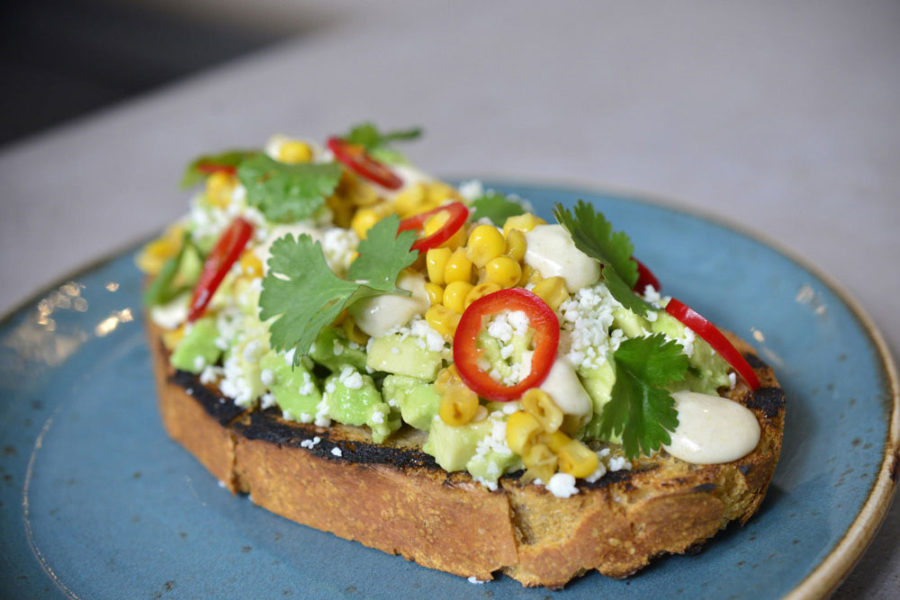 avocado toast topped with corn, feta cheese, and red pepper from b bistro at the grove in miami
