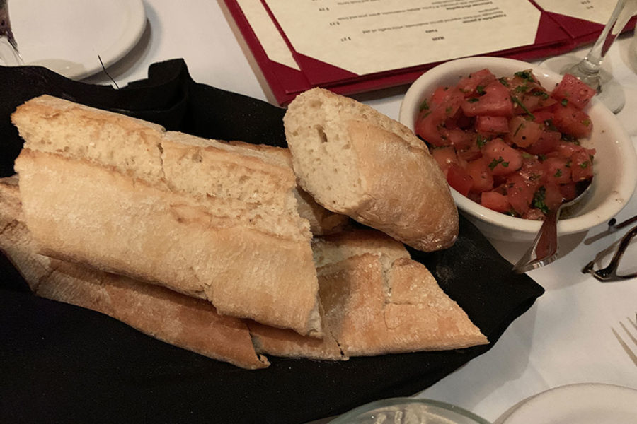 loaf of fresh bread and tomato chunks from fratellino ristorante in miami