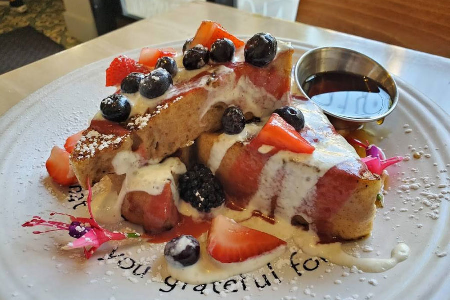 french toast topped with blueberries and strawberries