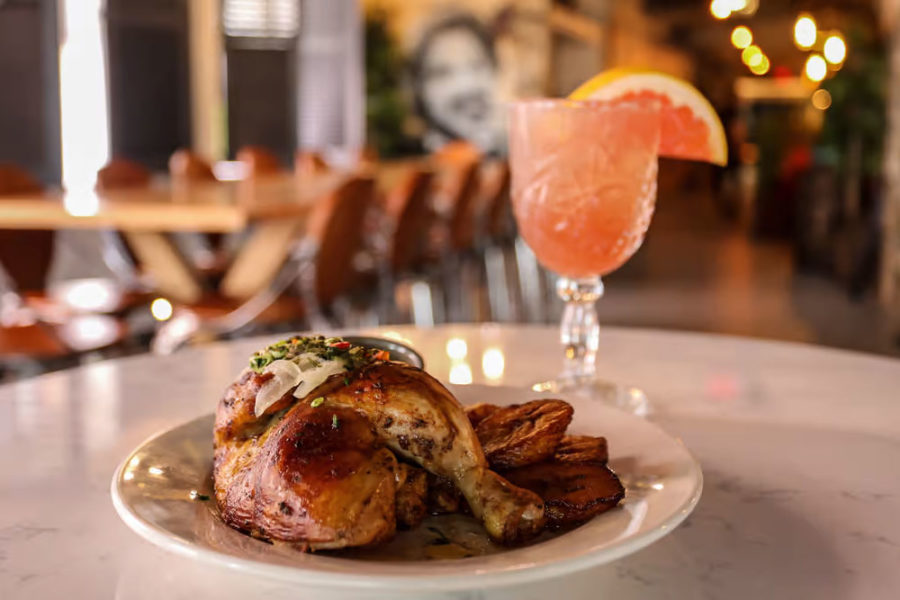 grilled chicken and cocktail from la fabrica central in boston