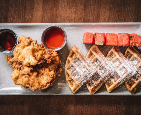 chicken and waffles with watermelon cubes on the side from link pin new bern in charlotte