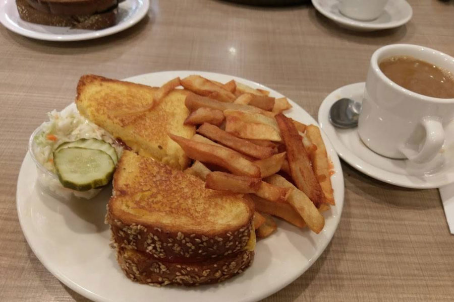 a grilled cheese sandwich with sides of fries and coleslaw and a cup of coffee from lou mitchells in chicago