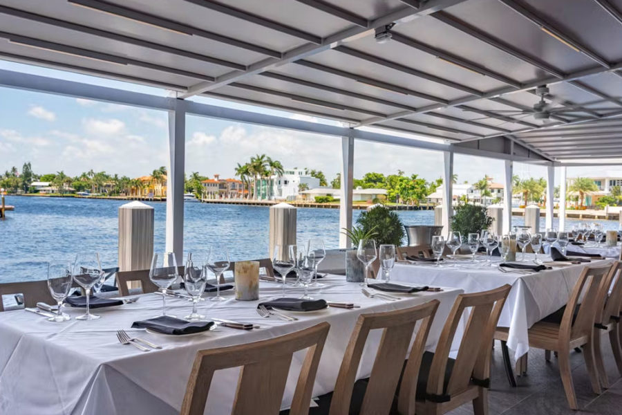 outdoor dining with view of waterfront at mastro's ocean club in miami