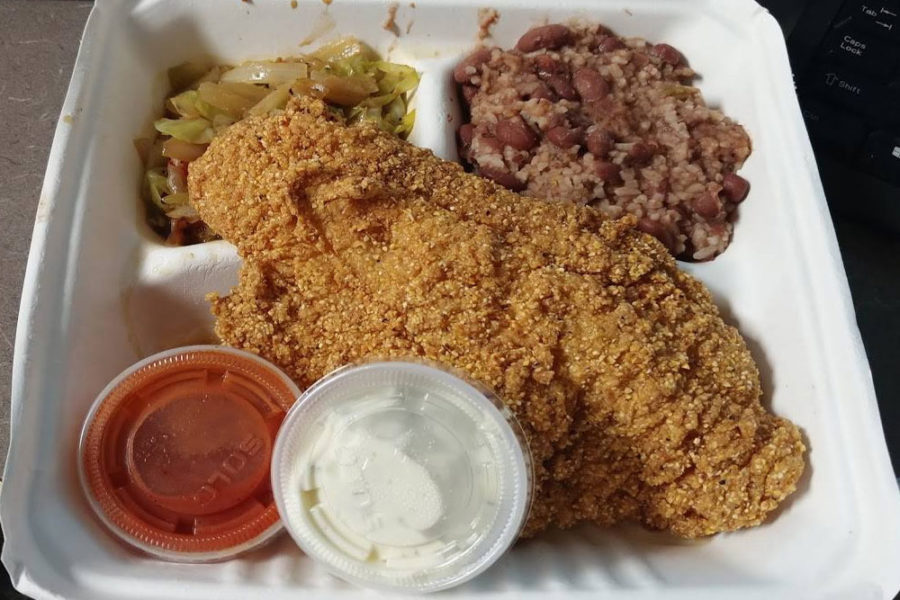 fried fish with sides of cabbage and rice from soulful dishes in seattle