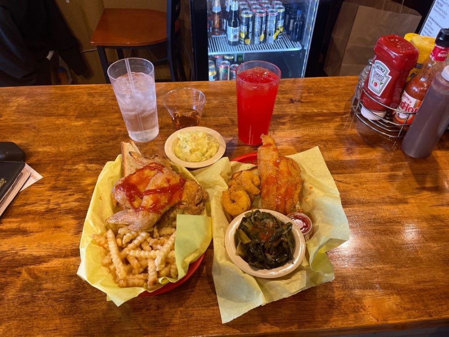chicken wings with side of french fries and chicken wings with sides of fried shrimp and collard greens from The Blazing Chicken Shack in Denver