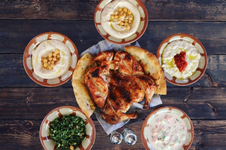 A whole Rotisserie chicken with naan and hummus from The Charcoal Resturant