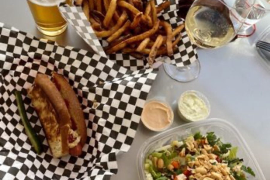 A hotdog, fries, salad, and beer from Sister Helen
