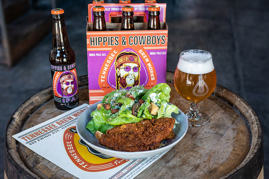 The Hippies and Cowboys IPA behind a salad and chicken-fried-steak from Tennessee Brew Works