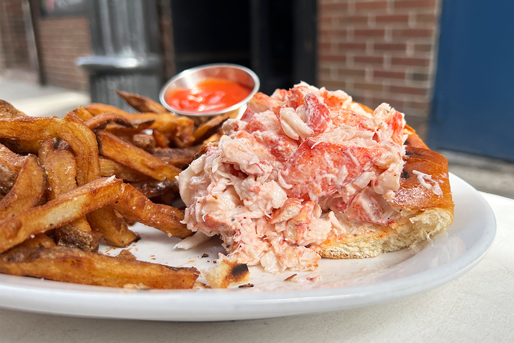 Lobster roll with fries and ketchup from Neptune's Oyster Bar in Boston, MA