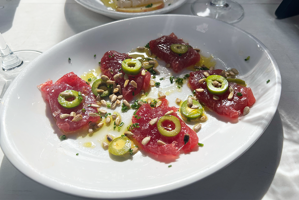 Bluefin crudo with pepitas and olives from Neptune Oyster Bar in Boston, MA
