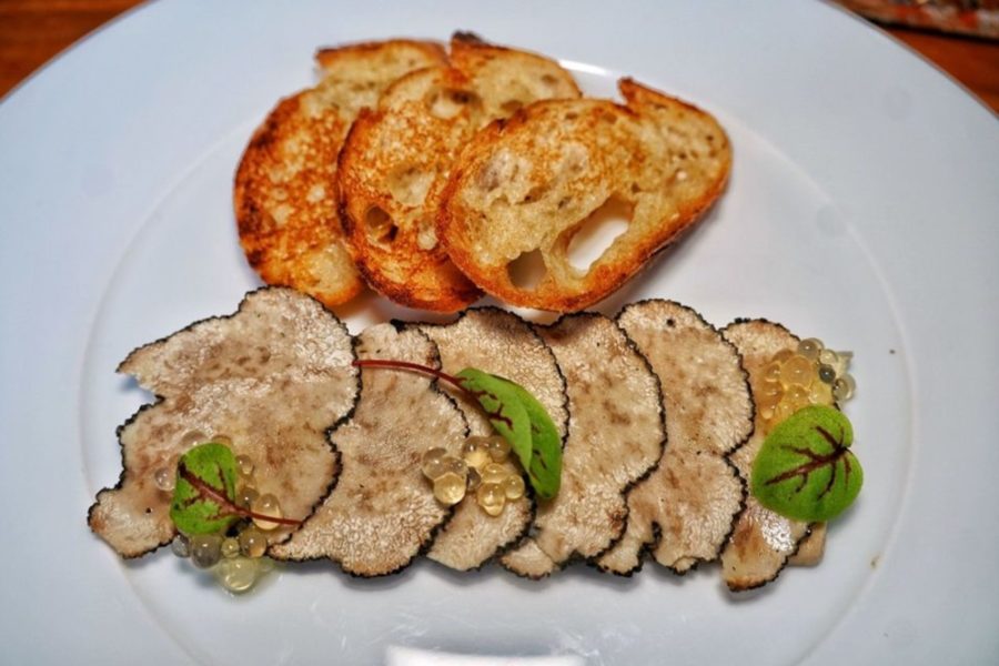 Foie gras topped with black truffles and some buttered baguette from 84 Yesler in Seattle