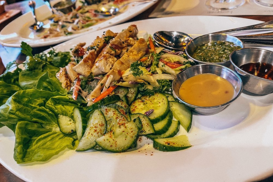 Thai lettuce wraps Sweet Chili-Glazed Chicken, Asian Cabbage Slaw with Pineapple, Crunchy Wontons, Bibb Lettuce; Sesame Ginger, Cashew, and Ponzu-Ginger Sauces
