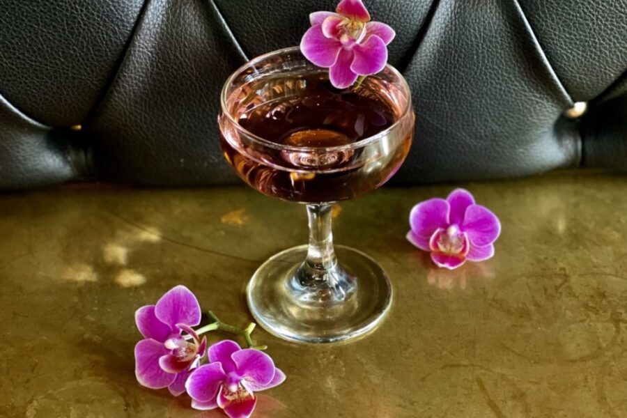 cocktail with orchids from The Carlile Room in Seattle