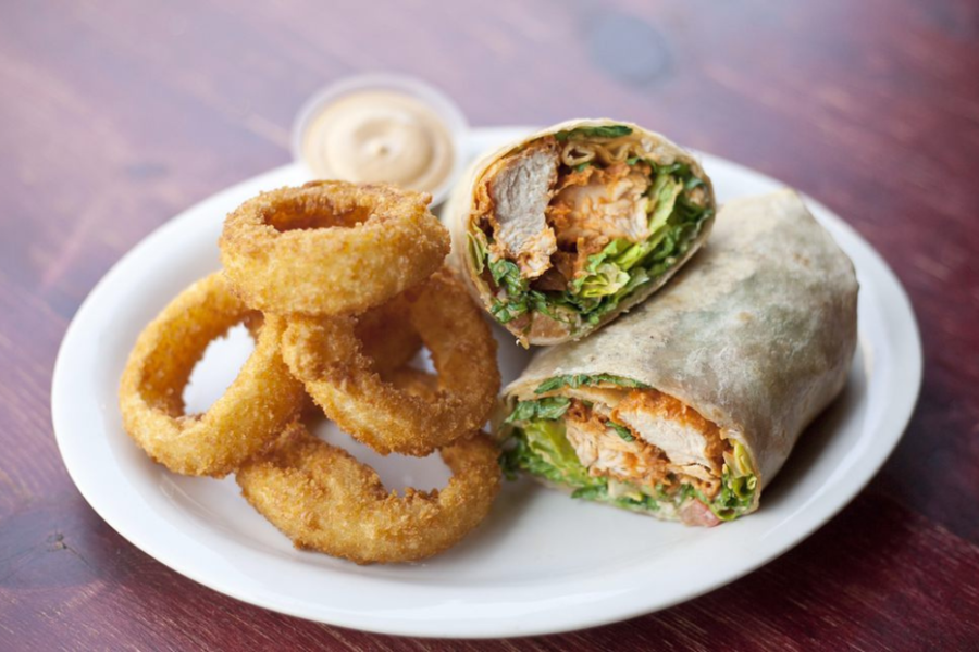 crispy buffalo chicken wrap with onion rings from taste and thirst in San Diego