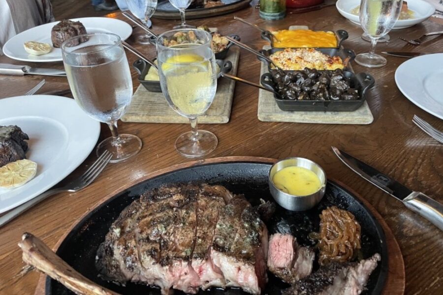 Tomahawk ribeye with assorted appetizers from Oak Steakhouse in Charleston