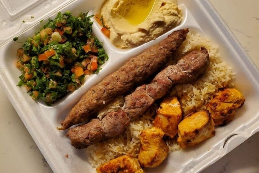 ultimate mixed grill entree with hummus, rice greens, chicken, and beef shish kebab from Open Sesame in Dallas