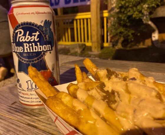animal fries and PBR from Dino's in Nashville