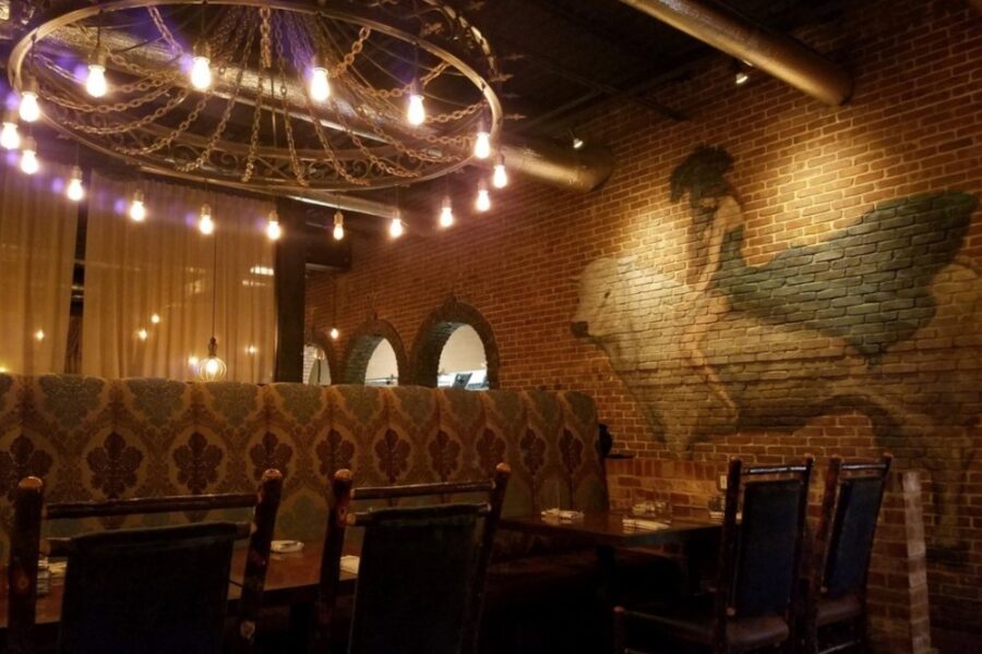 dining area and mural at Le Moo in Louisville