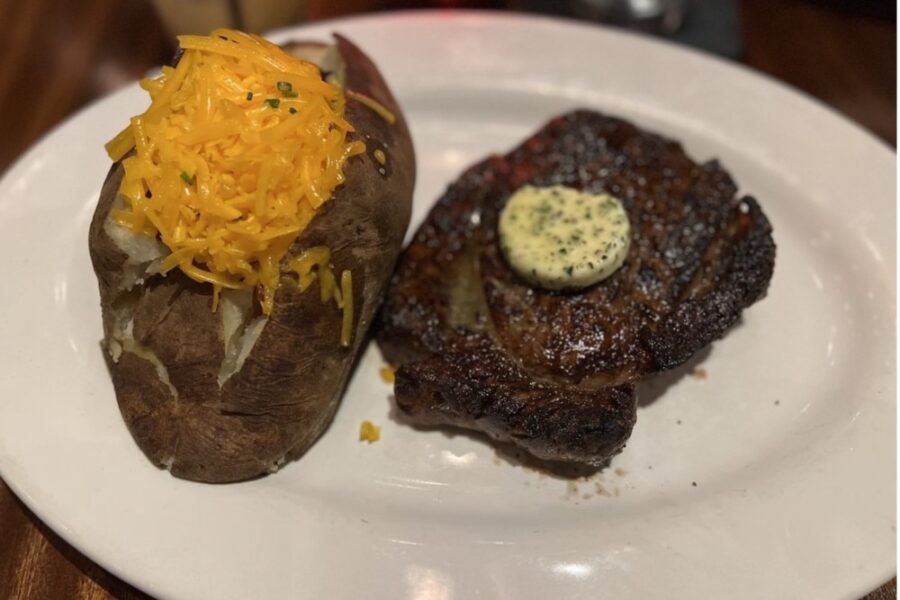 colossal baked potato and rib eye steak from Steak & Bourbon in Louisville
