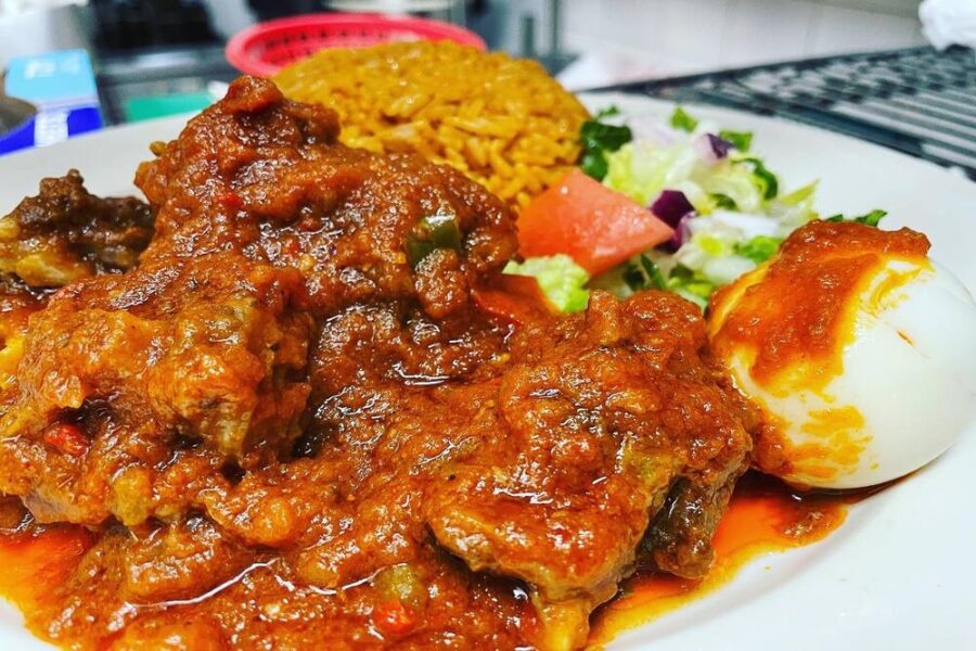 Appioo Jollof and Goat Stew from Appioo African Bar & Grill in Washington DC