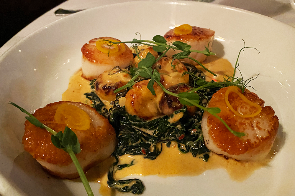 Scallops and gnocchi with sauteed greens 