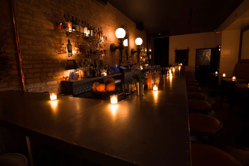 Candlelit bar at The Victor in Chicago