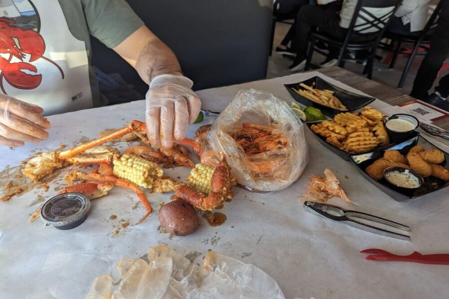 crab legs and corn from boxing crab in San Diego