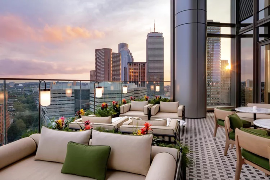 A rooftop patio overlooking the Boston skyline